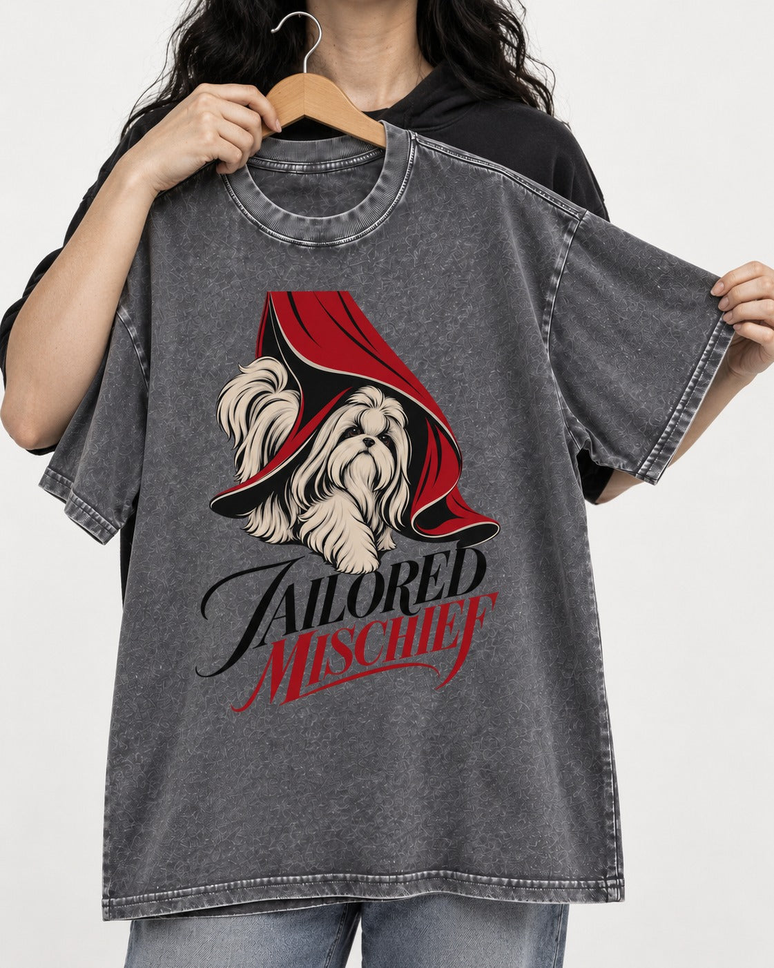 Tailored Mischief Shih Tzu Washed Tee in Gray, held up on a hanger