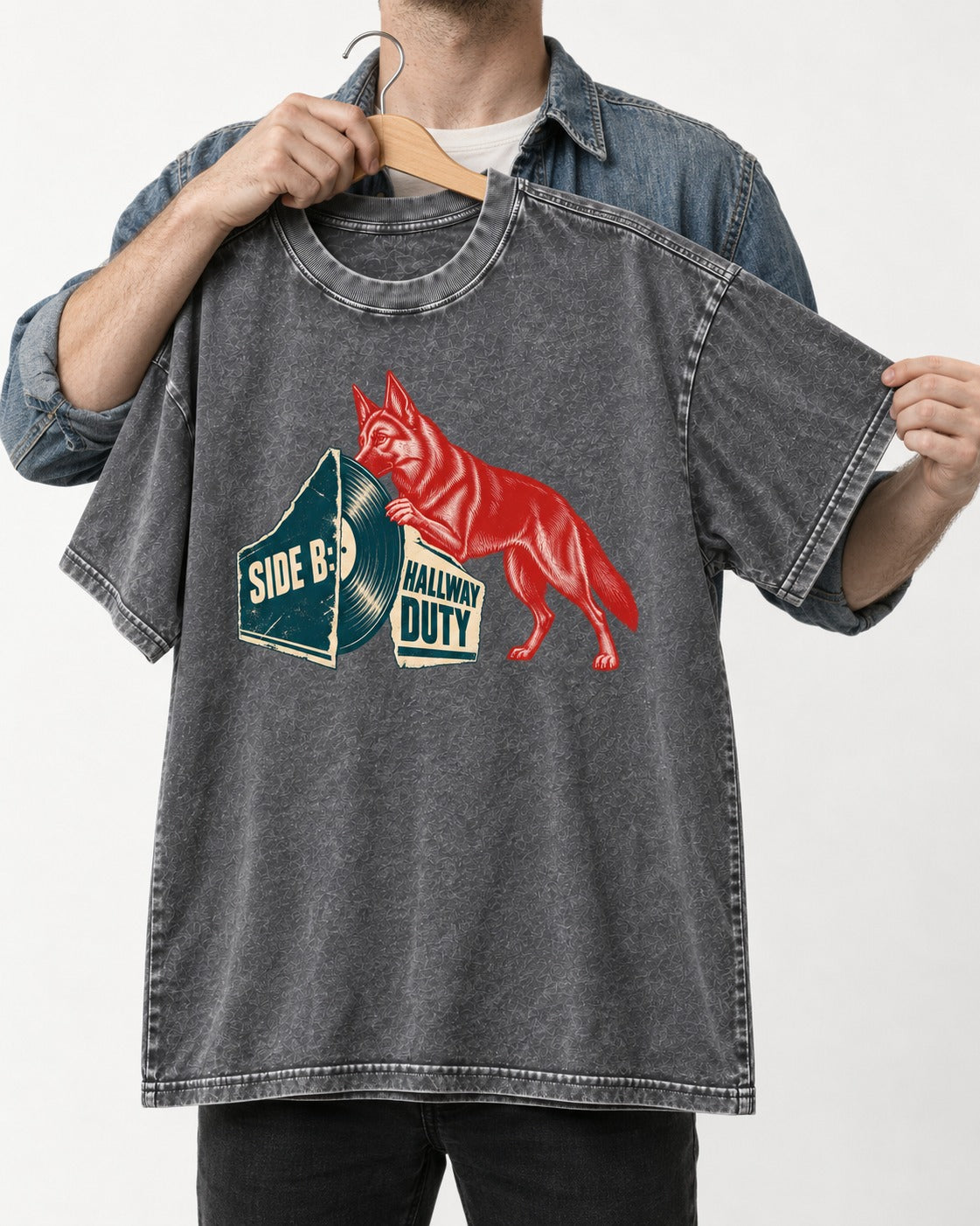Side B Hallway Duty Vinyl Record German Shepherd Dog Graphic Washed Tee in Gray, held up on a hanger