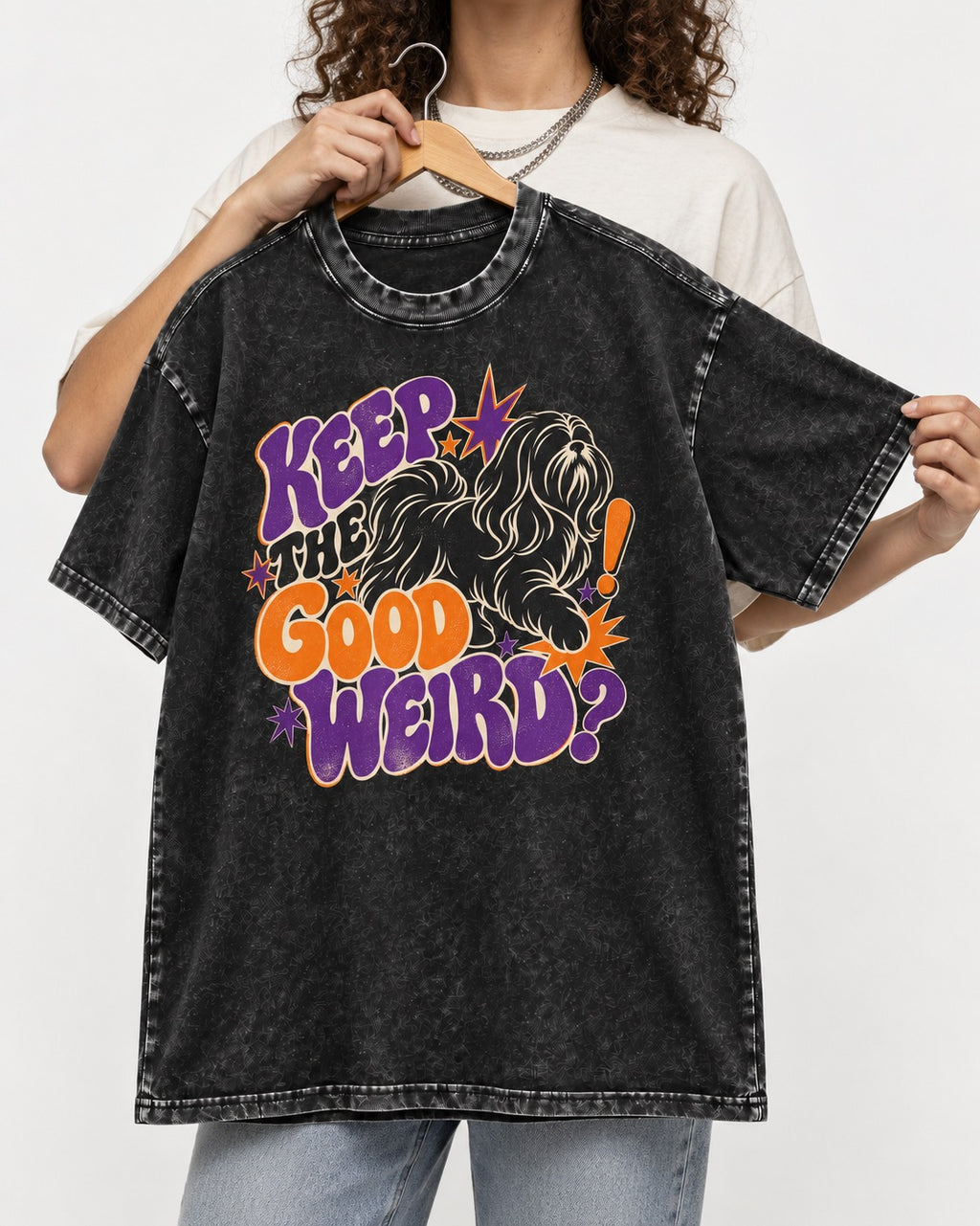 Shih Tzu Keep the Good Weird Retro Typography Graphic Washed Tee in Black, held up on a hanger