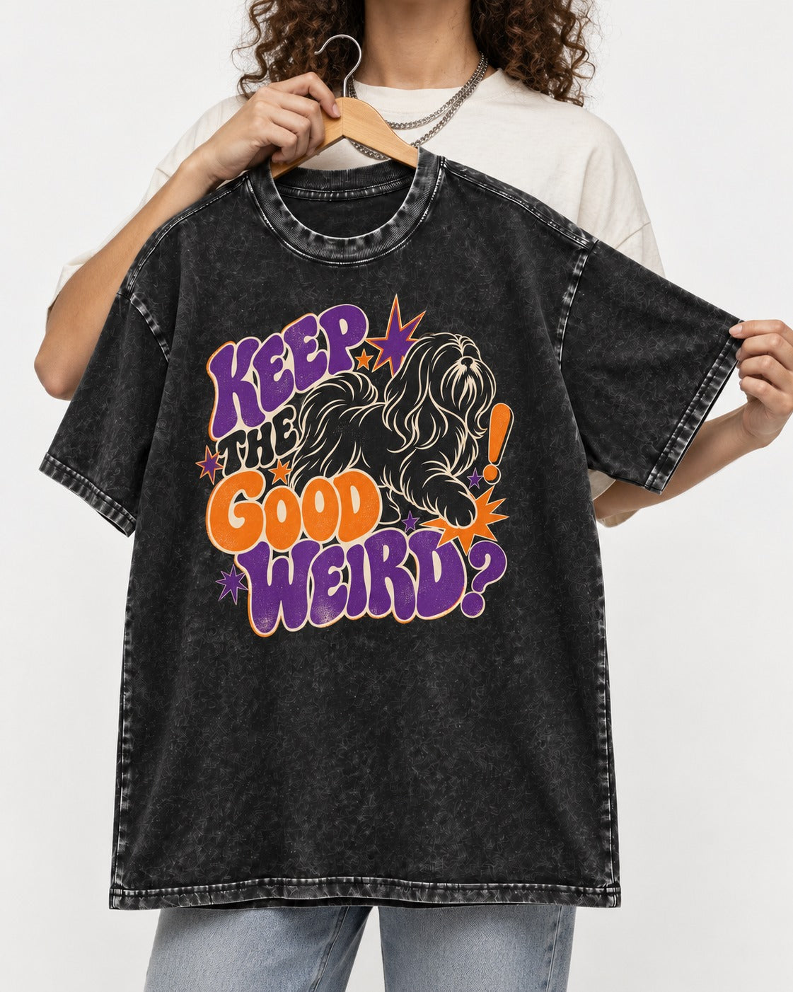 Shih Tzu Keep the Good Weird Retro Typography Graphic Washed Tee in Black, held up on a hanger