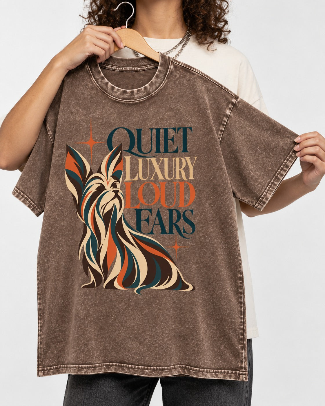 Quiet Luxury Loud Ears Yorkshire Terrier Washed Tee in Coffee, held up on a hanger