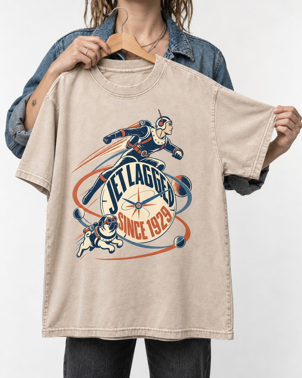Jet Lagged Pug Washed Tee in Apricot, held up on a hanger