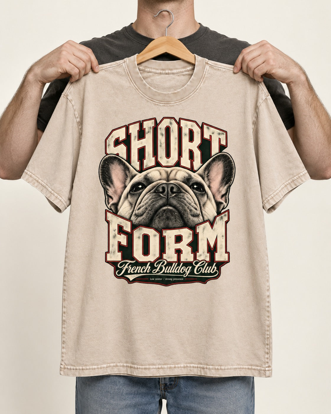 Short Form Frenchie Washed Tee in Apricot, held up on a hanger