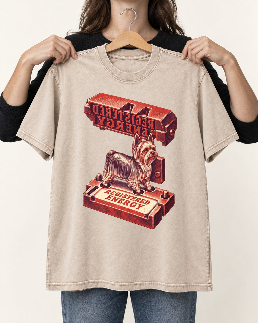 Yorkshire Terrier Registered Energy Stamp Press Graphic Washed Tee in Apricot, held up on a hanger