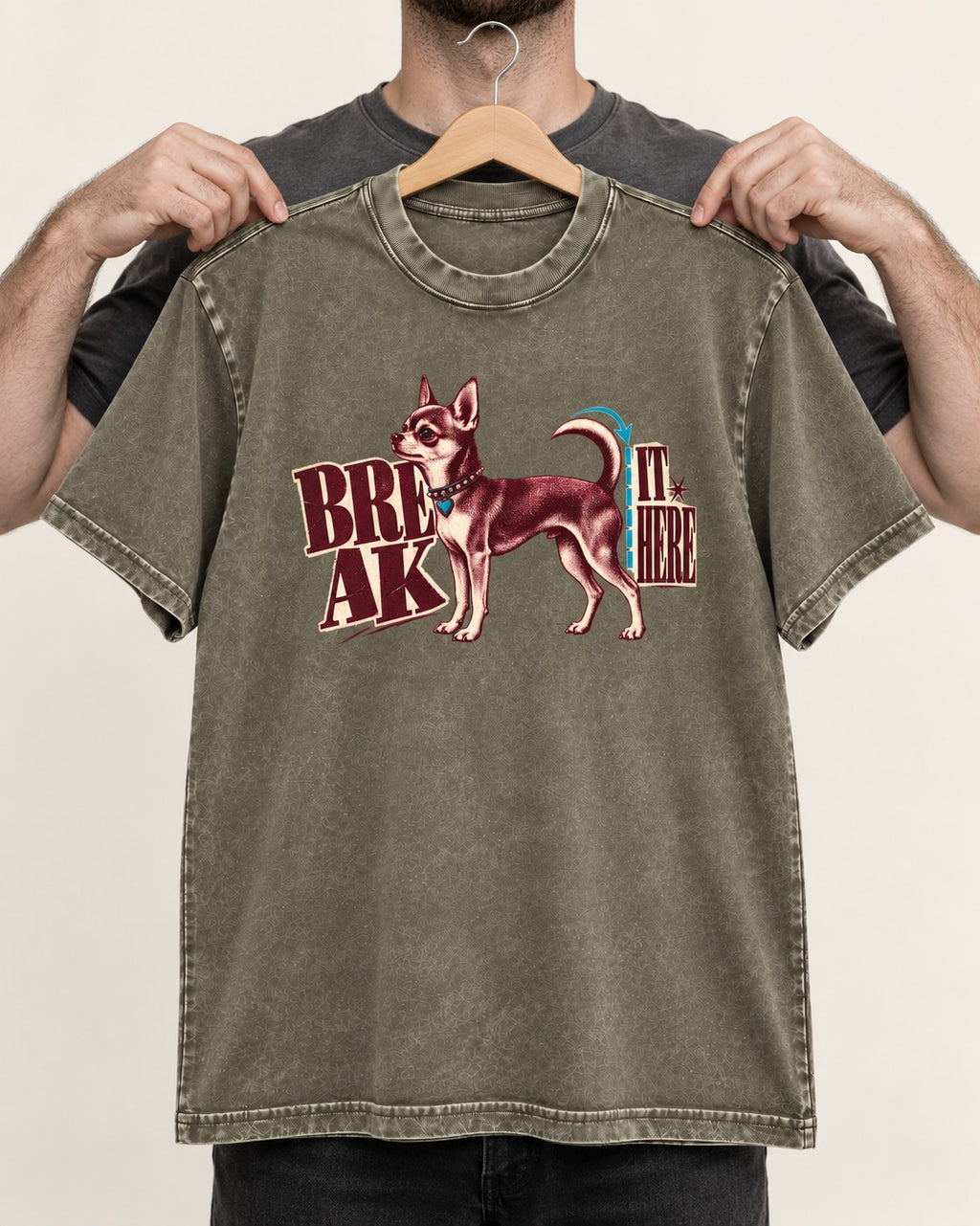 Chihuahua Break It Here Perforation Graphic Washed Tee in Army Green, held up on a hanger