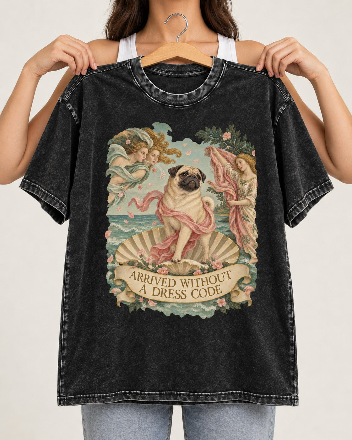 Pug Arrived Without a Dress Code Venus Parody Graphic Washed Tee in Black, held up on a hanger