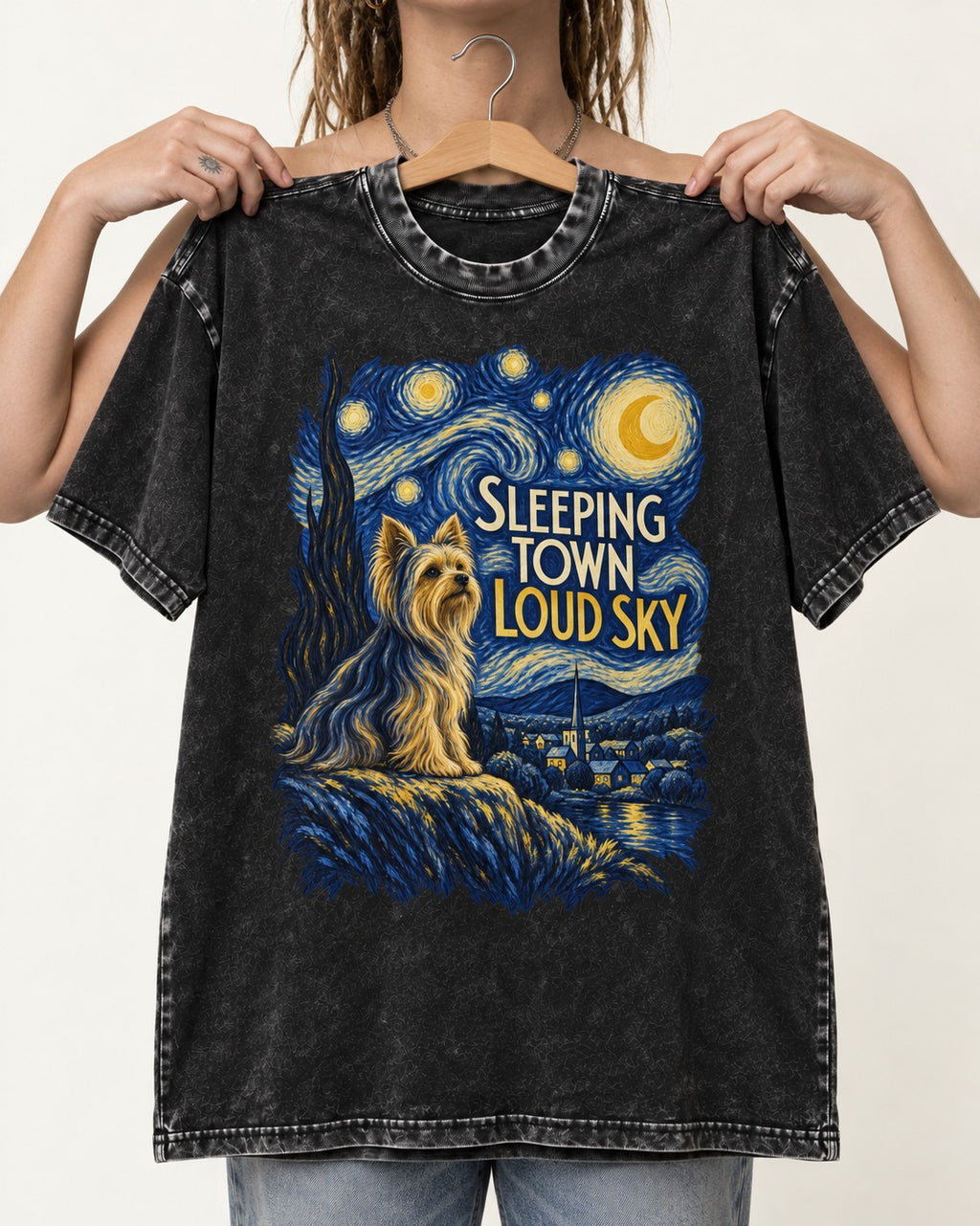 Yorkshire Terrier Sleeping Town Loud Sky Starry Night Graphic Washed Tee in Black, held up on a hanger