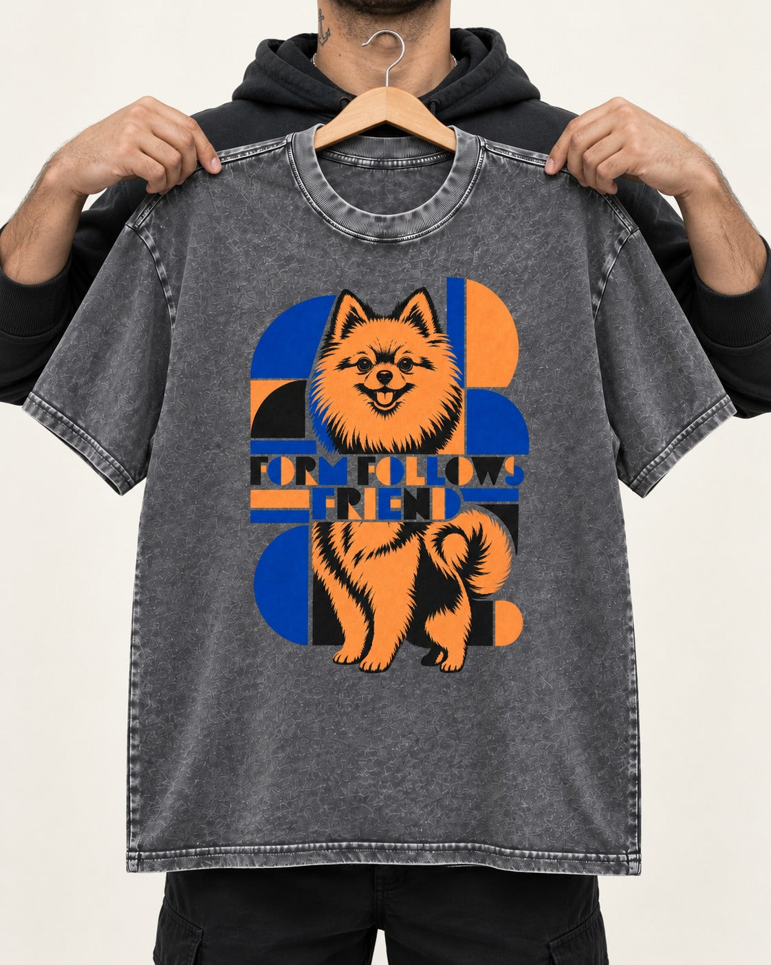 Form Follows Pomeranian Friend Washed Tee in Gray, held up on a hanger