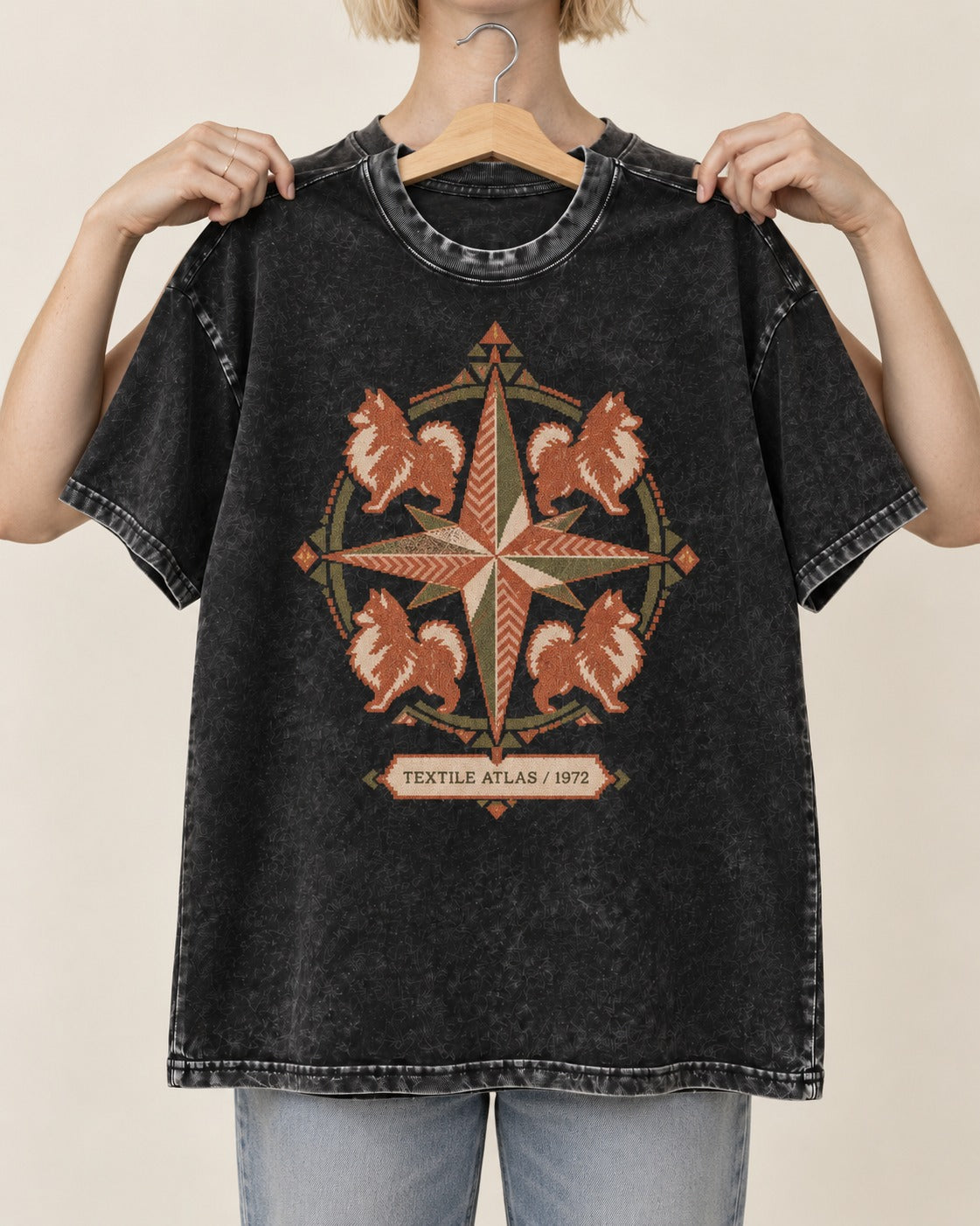 Pomeranian Textile Atlas Compass Rose Graphic Washed Tee in Black, held up on a hanger