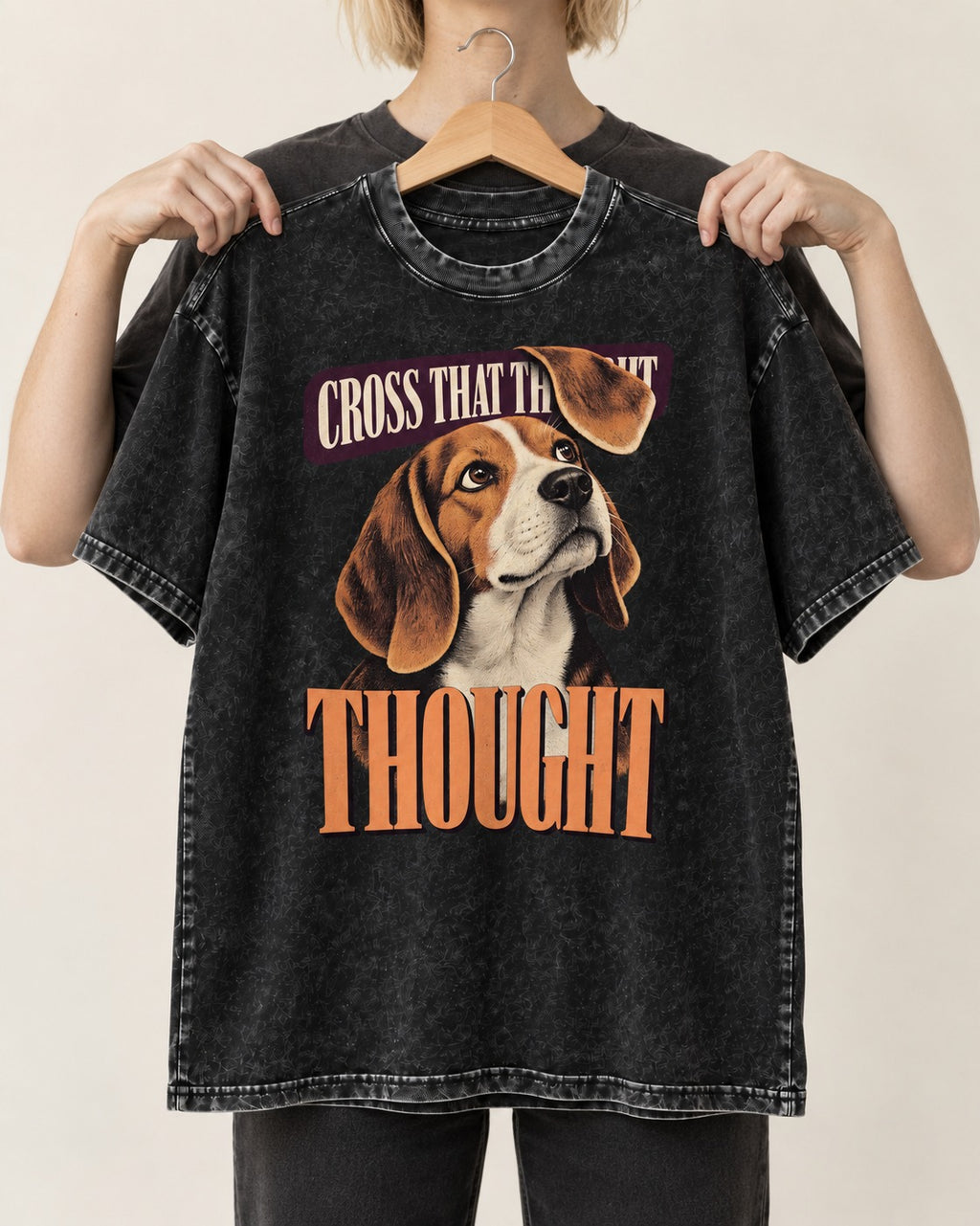 Cross That Beagle Thought Washed Tee in Black, held up on a hanger