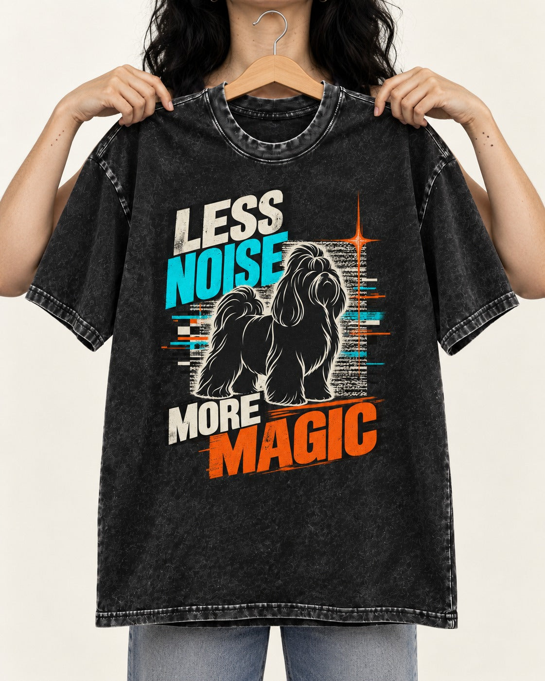 Shih Tzu Less Noise More Magic Pop Art Graphic Washed Tee in Black, held up on a hanger