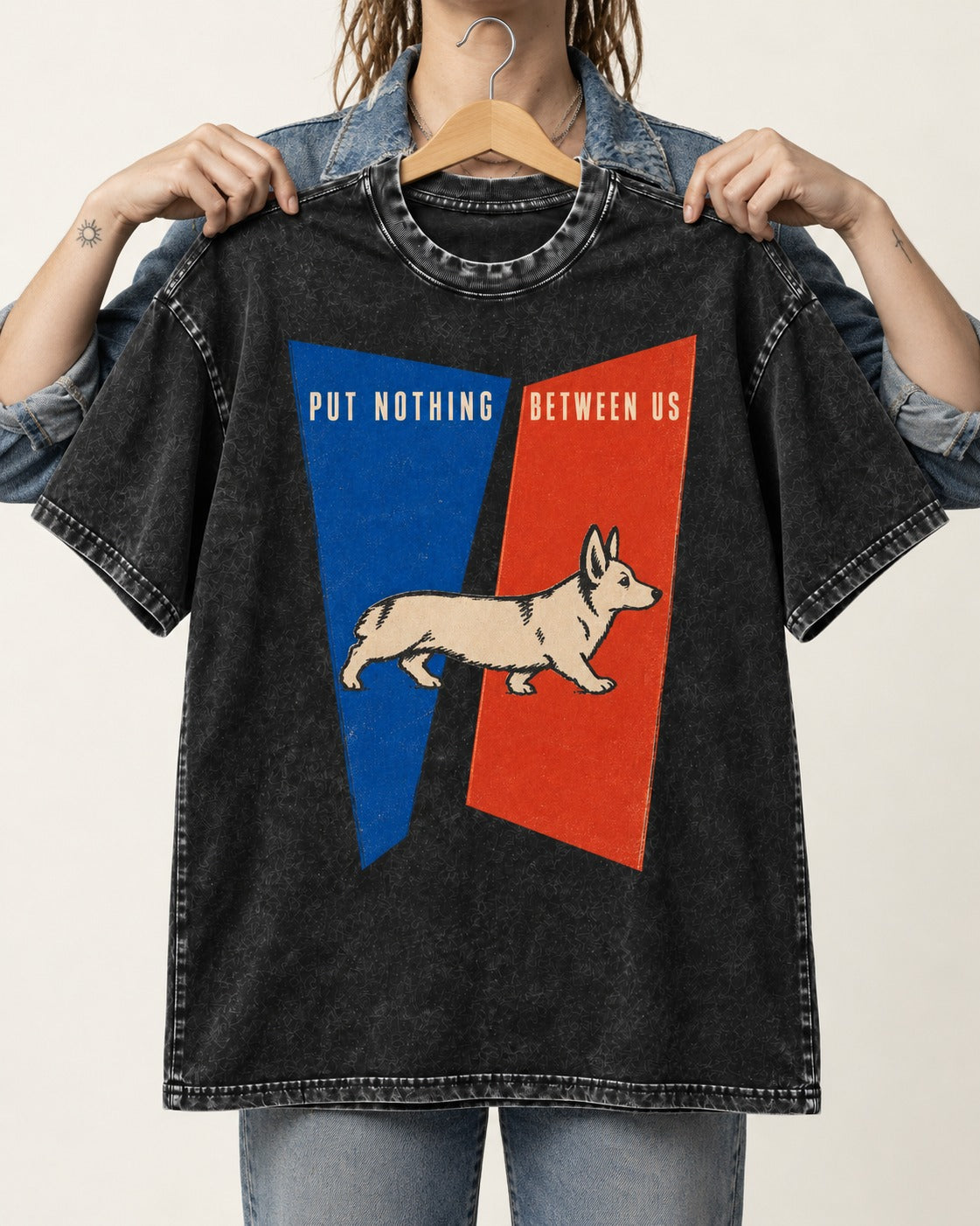 Corgi Put Nothing Between Us Split Panels Washed Tee in Black, held up on a hanger