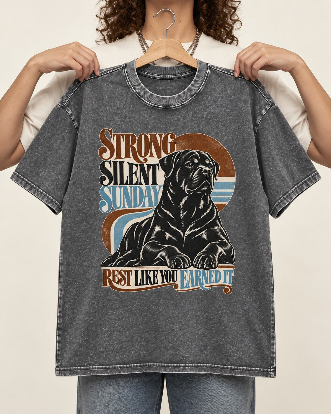 Strong Silent Sunday Rottweiler Washed Tee in Gray, held up on a hanger