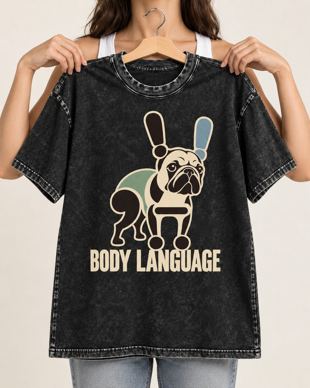 Frenchie Body Language Punctuation Graphic Washed Tee in Black, held up on a hanger