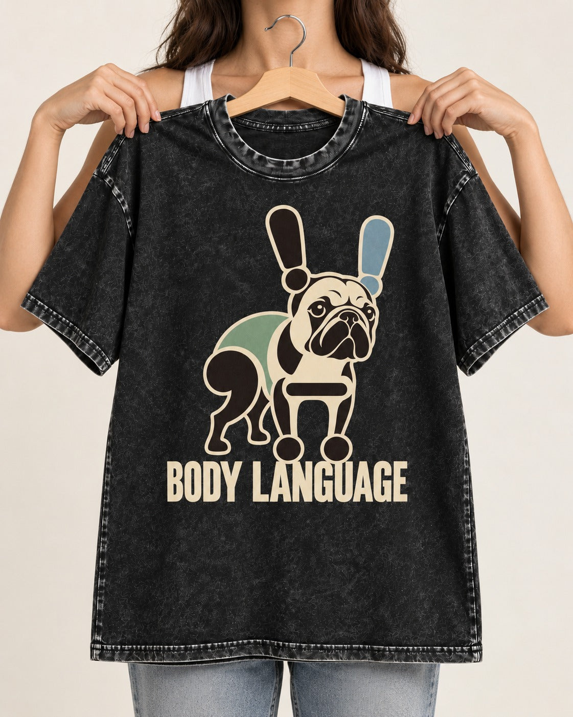 Frenchie Body Language Punctuation Graphic Washed Tee in Black, held up on a hanger