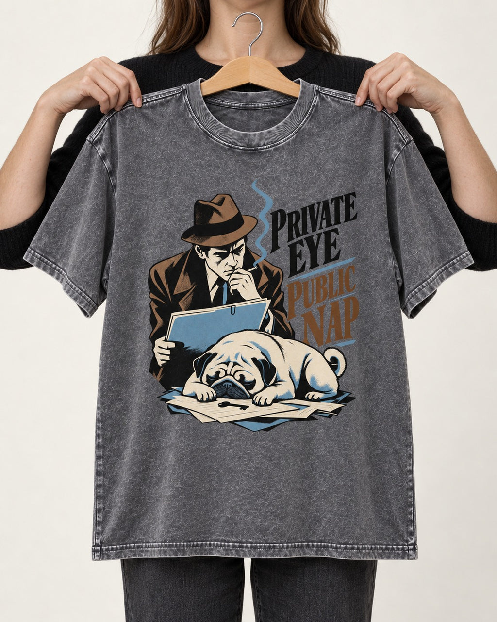 Pug Private Eye Public Nap Washed Tee in Gray, held up on a hanger