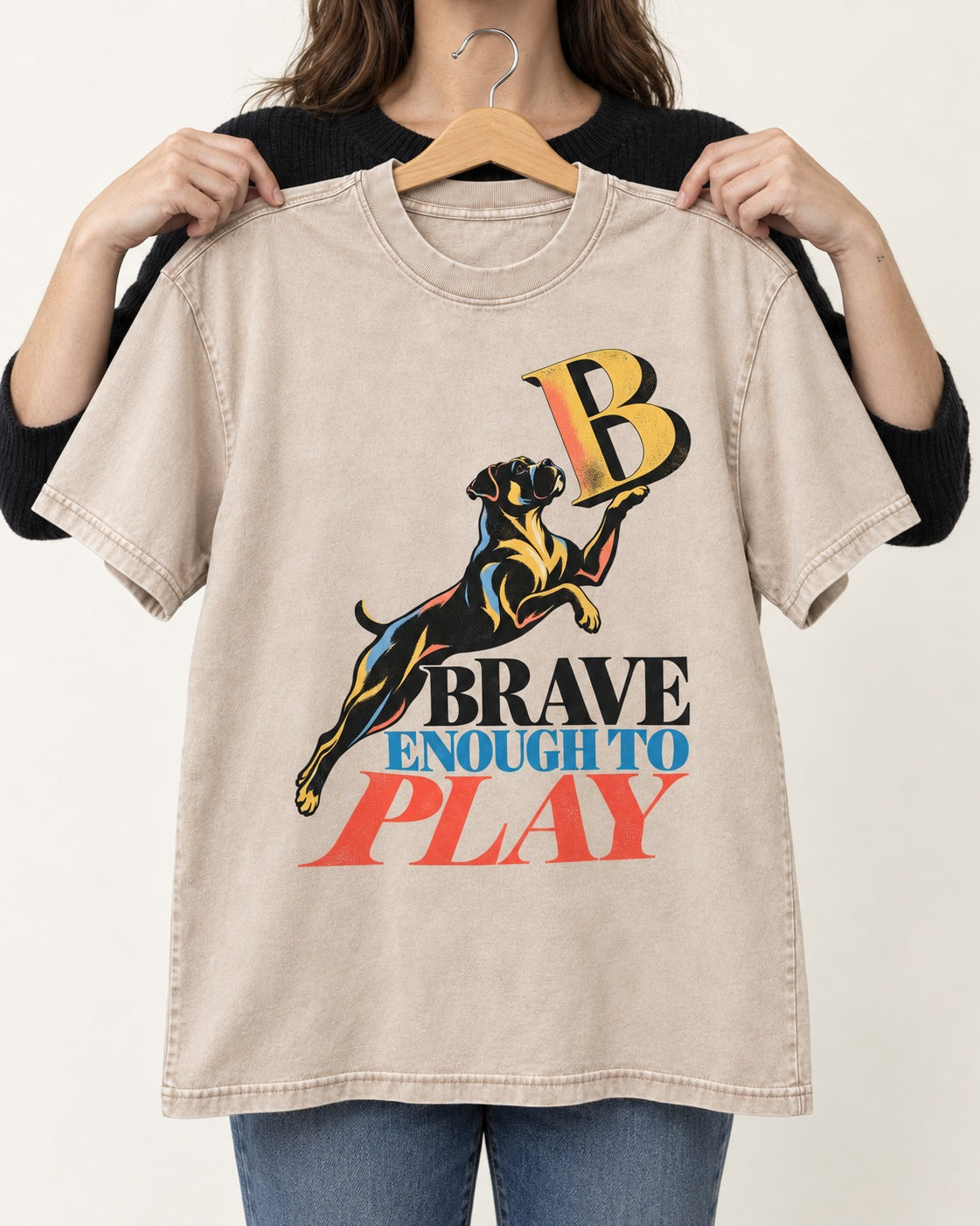 Boxer Brave Enough to Play Washed Tee in Apricot, held up on a hanger