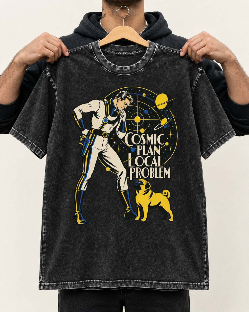 Pug Cosmic Plan Local Problem Astronaut Graphic Washed Tee in Black, held up on a hanger