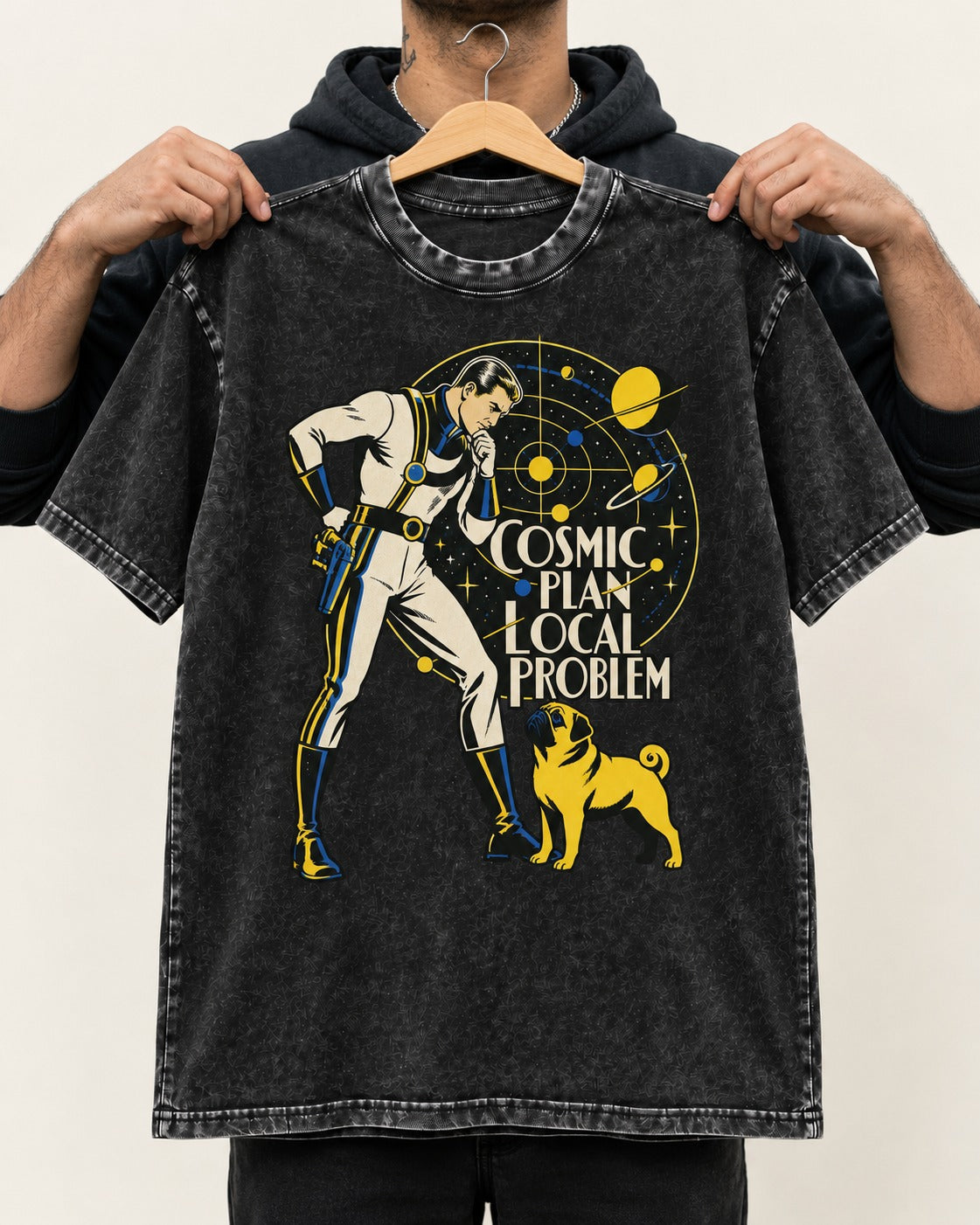 Pug Cosmic Plan Local Problem Astronaut Graphic Washed Tee in Black, held up on a hanger