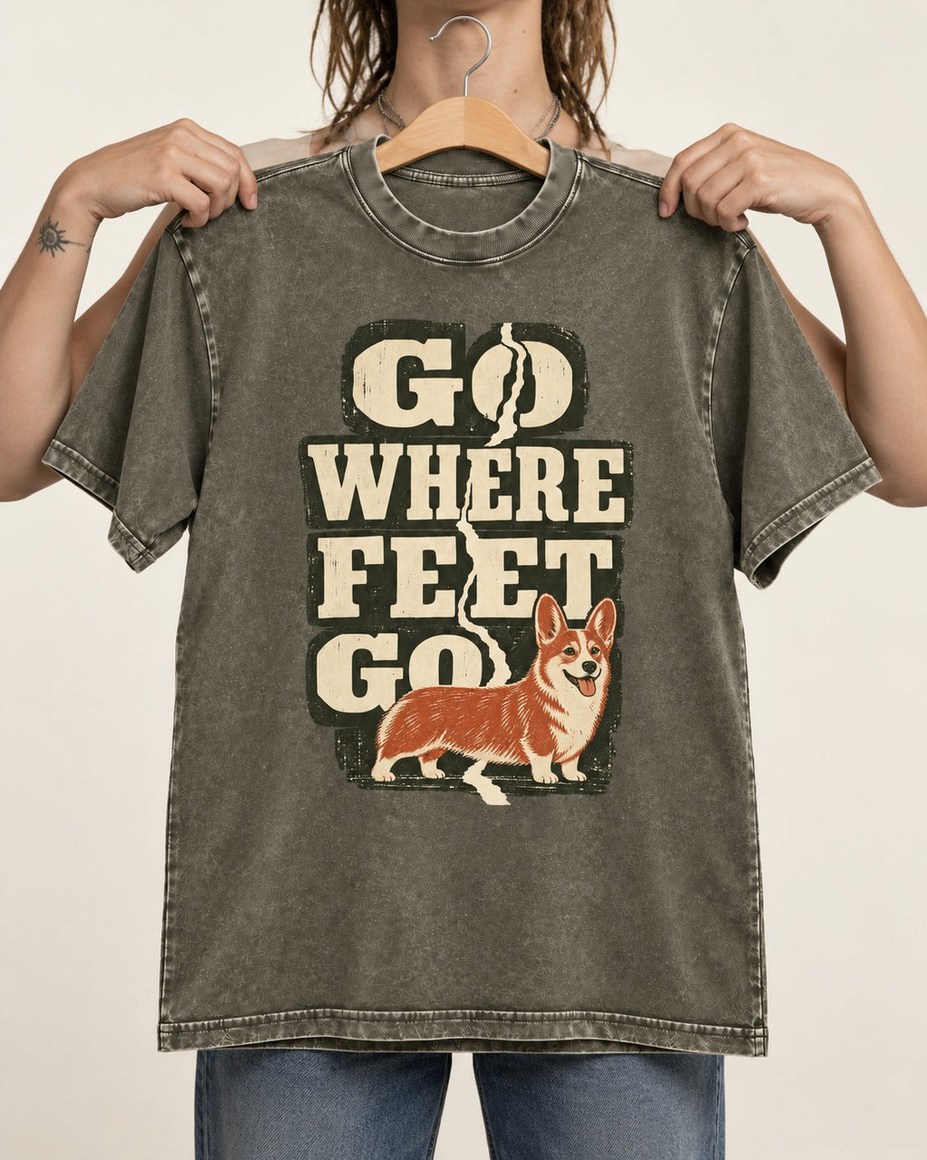 Corgi Go Where Feet Go Path Washed Tee in Army Green, held up on a hanger