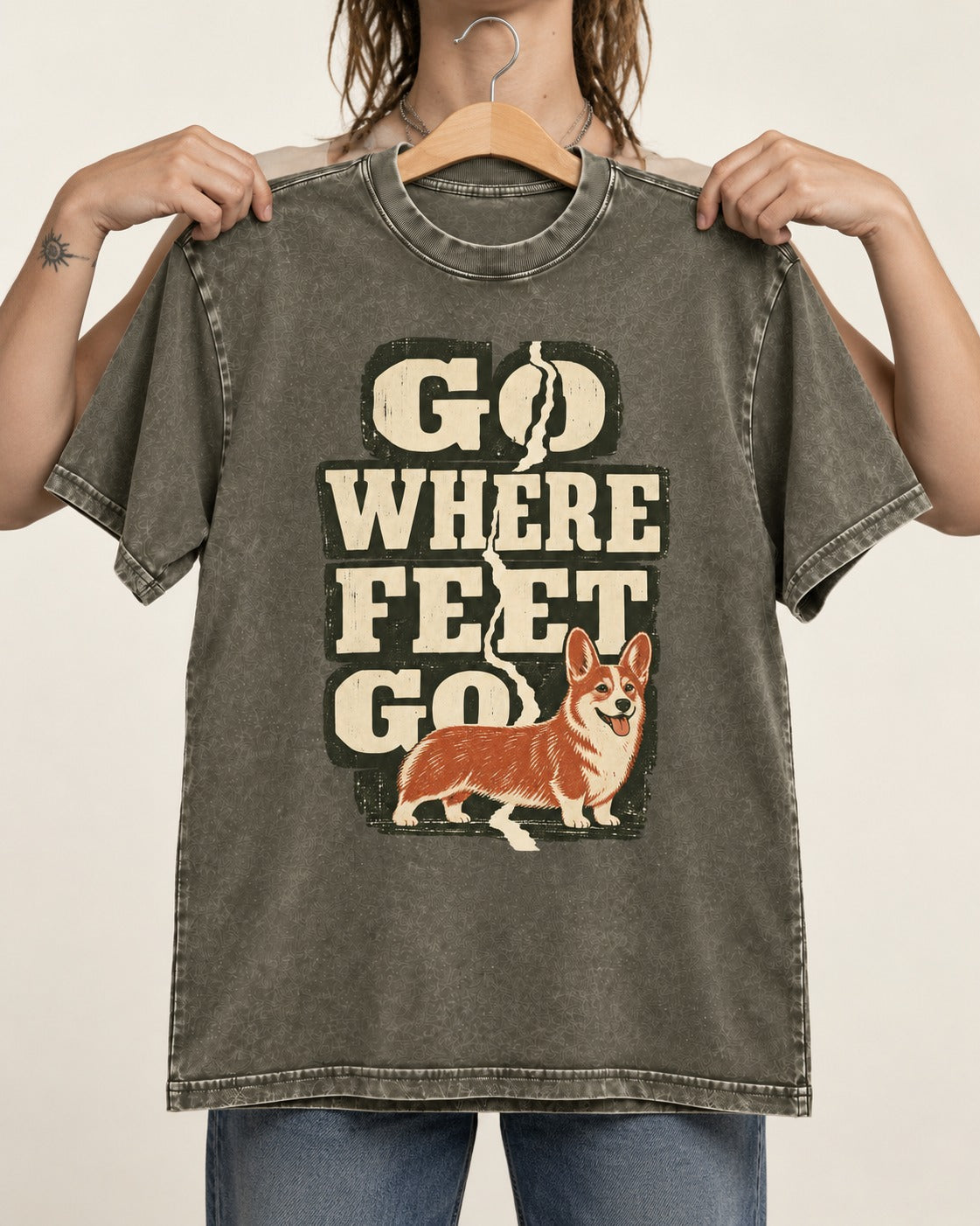 Corgi Go Where Feet Go Path Washed Tee in Army Green, held up on a hanger