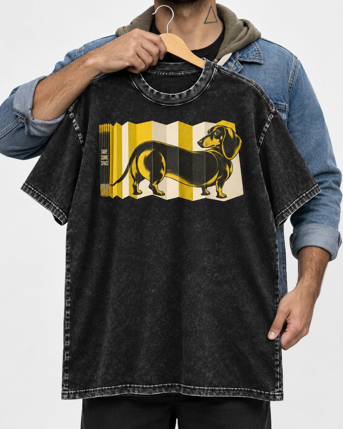 Dachshund Save Some Space Accordion Screen Graphic Washed Tee in Black, held up on a hanger