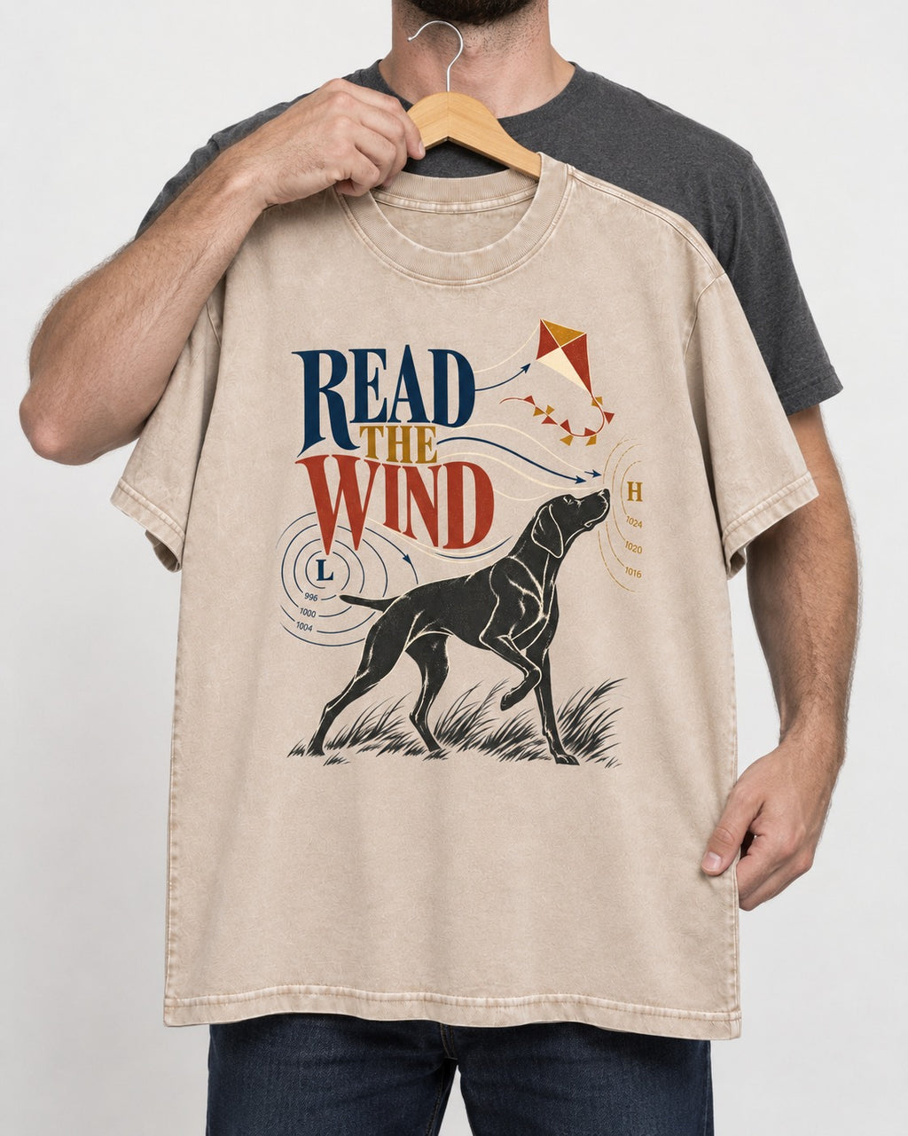 Read the Wind German Shorthaired Pointer Washed Tee in Apricot, held up on a hanger