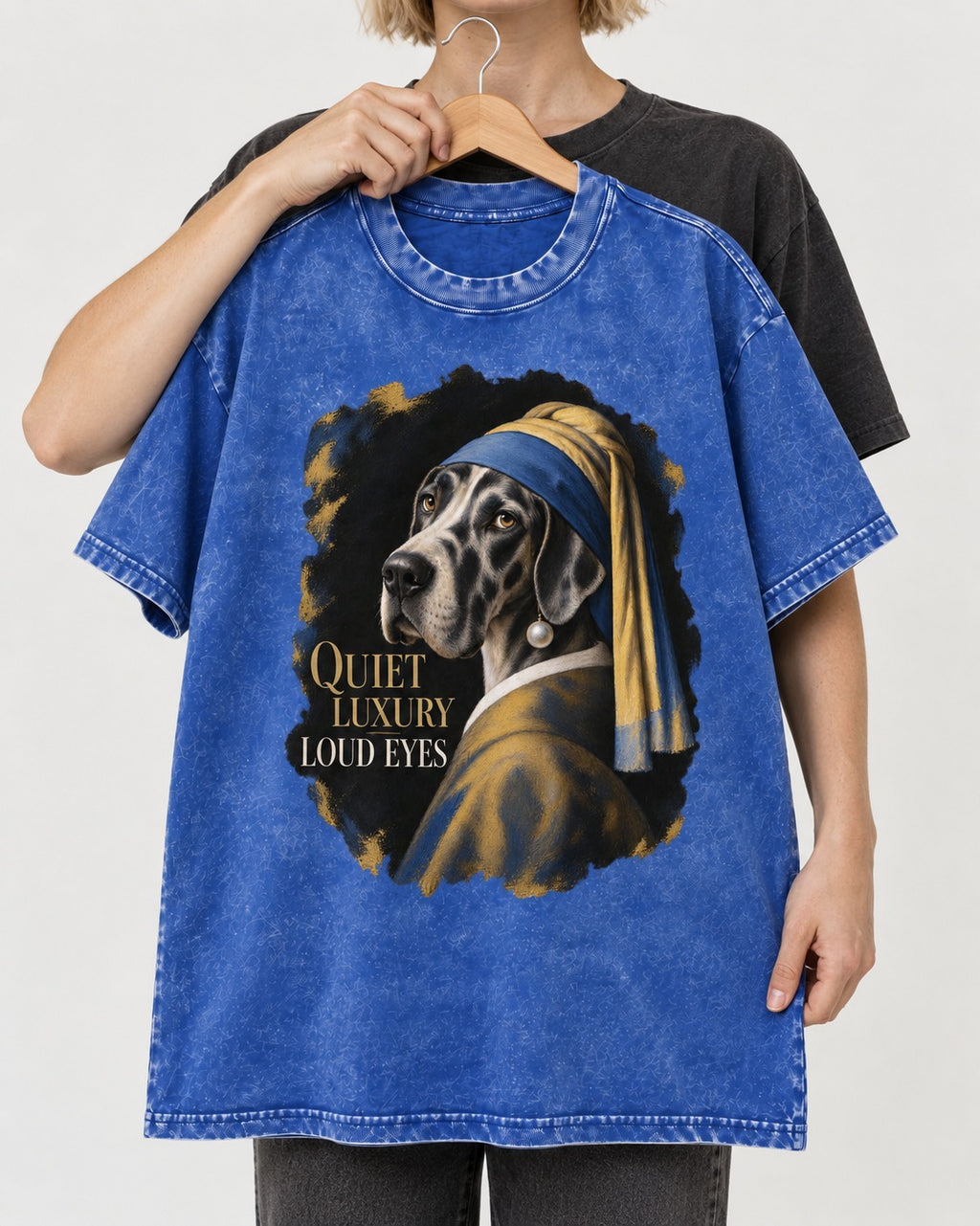 Great Dane Quiet Luxury Loud Eyes Pearl Portrait Graphic Washed Tee in Royal Blue, held up on a hanger