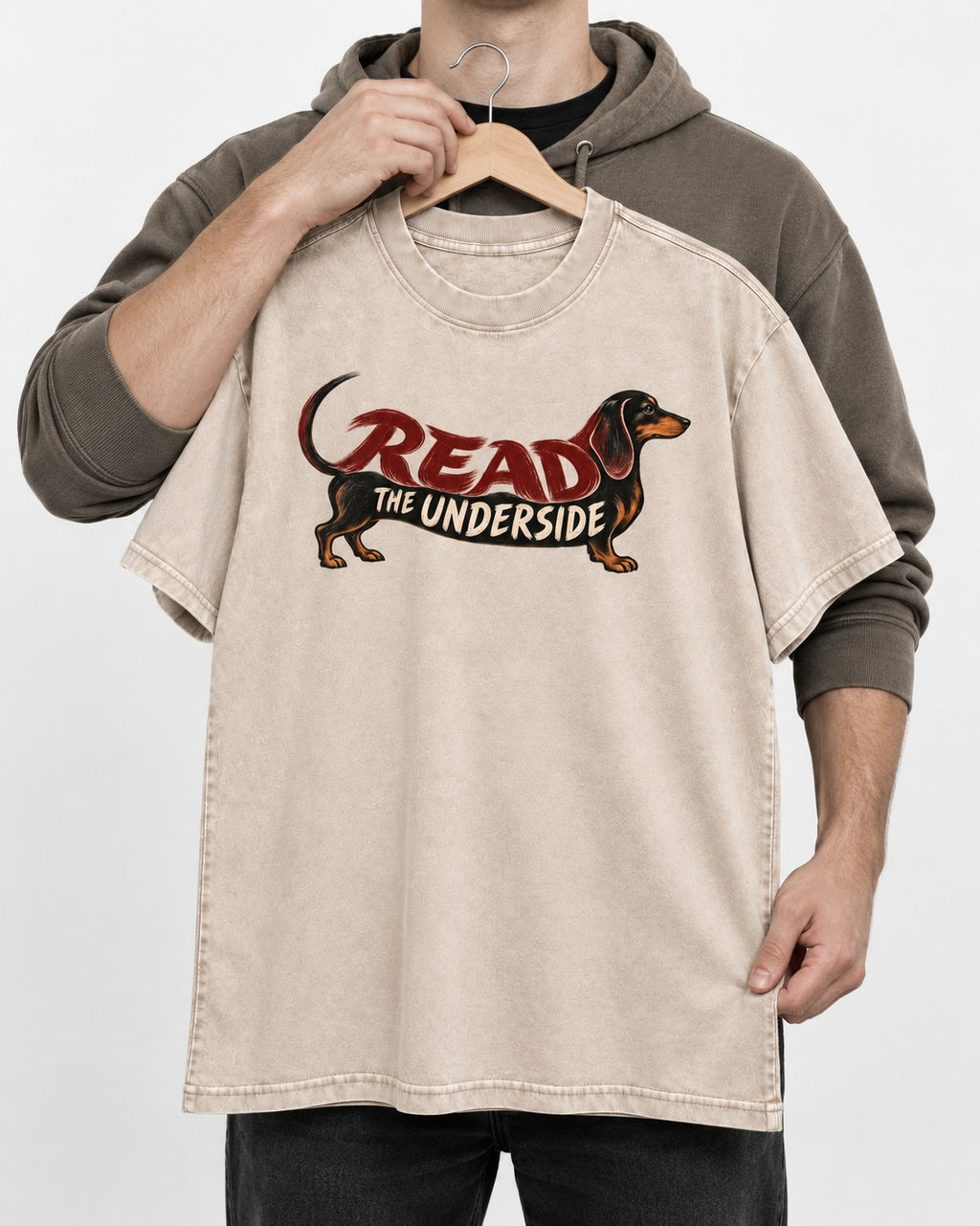 Dachshund Read The Underside Body Lettering Graphic Washed Tee in Apricot, held up on a hanger
