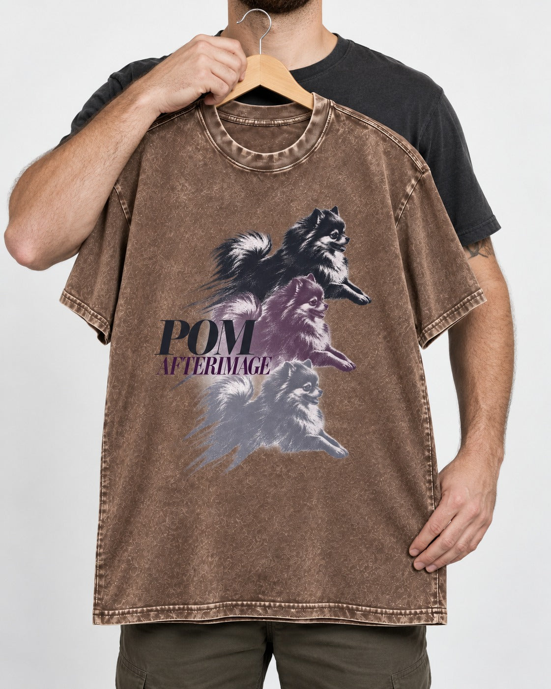 Pomeranian Afterimage Washed Tee in Coffee, held up on a hanger