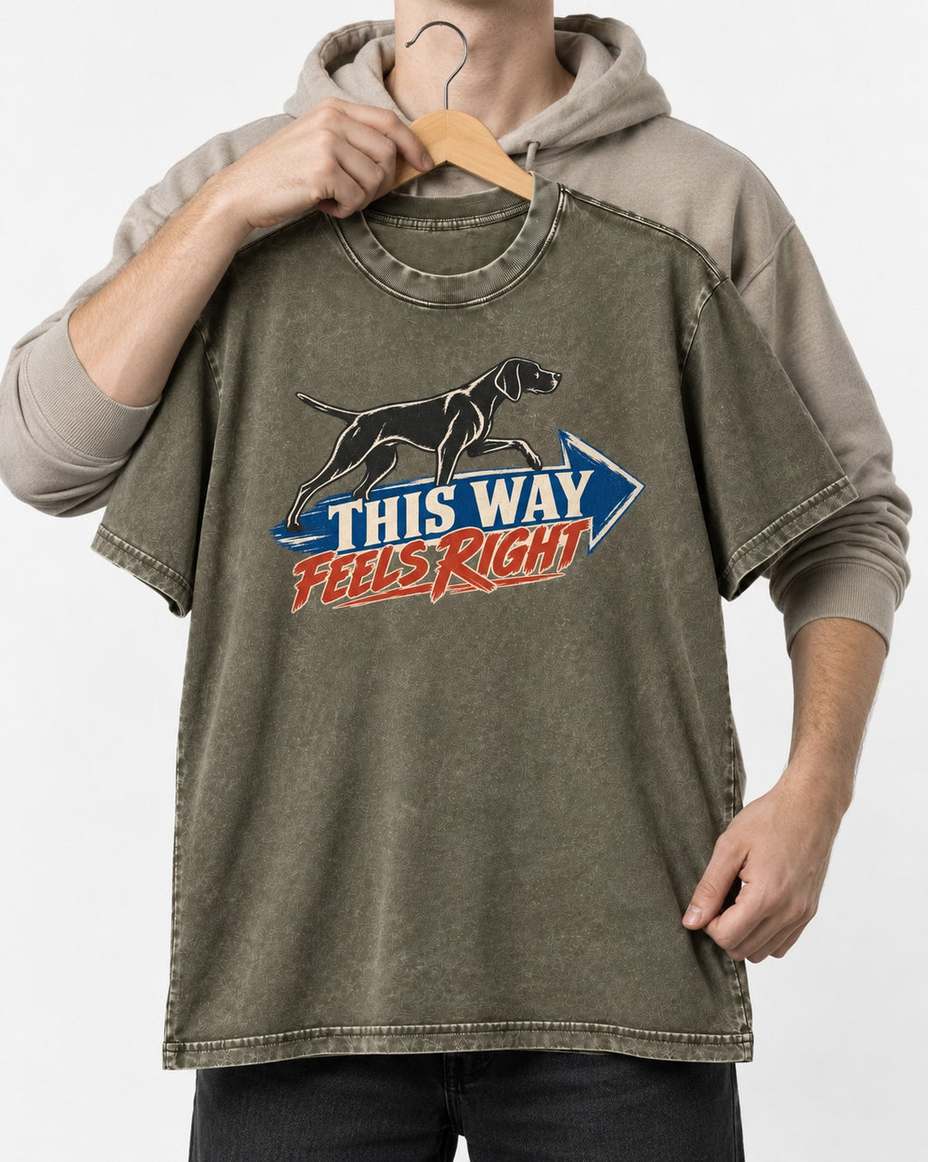This Way Feels Right Arrow German Shorthaired Pointer Graphic Washed Tee in Army Green, held up on a hanger