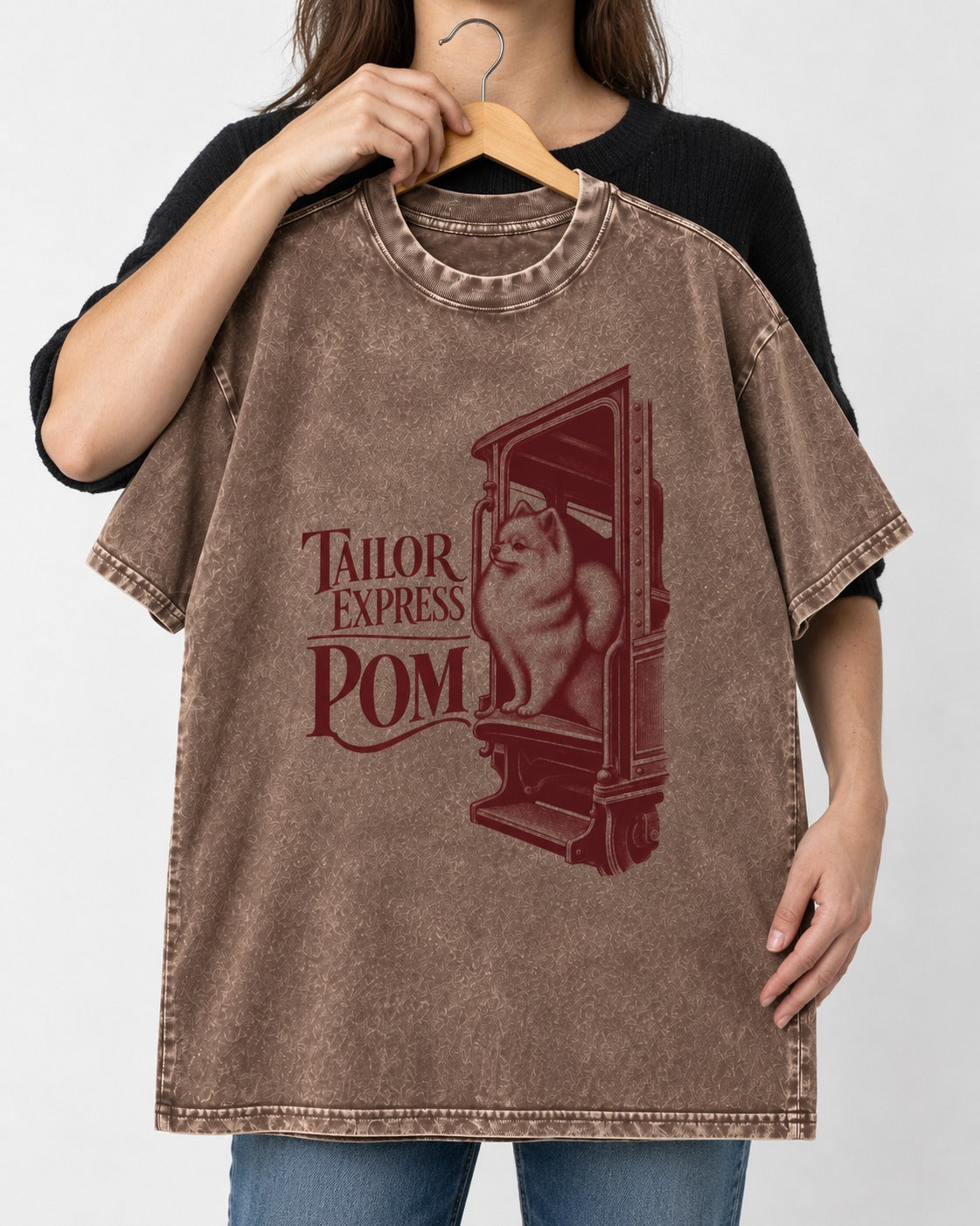 Pomeranian Express Washed Tee in Coffee, held up on a hanger