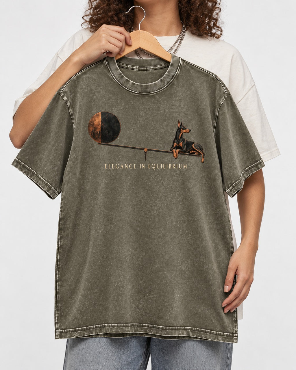 Doberman Elegance in Equilibrium Balance Graphic Washed Tee in Army Green, held up on a hanger