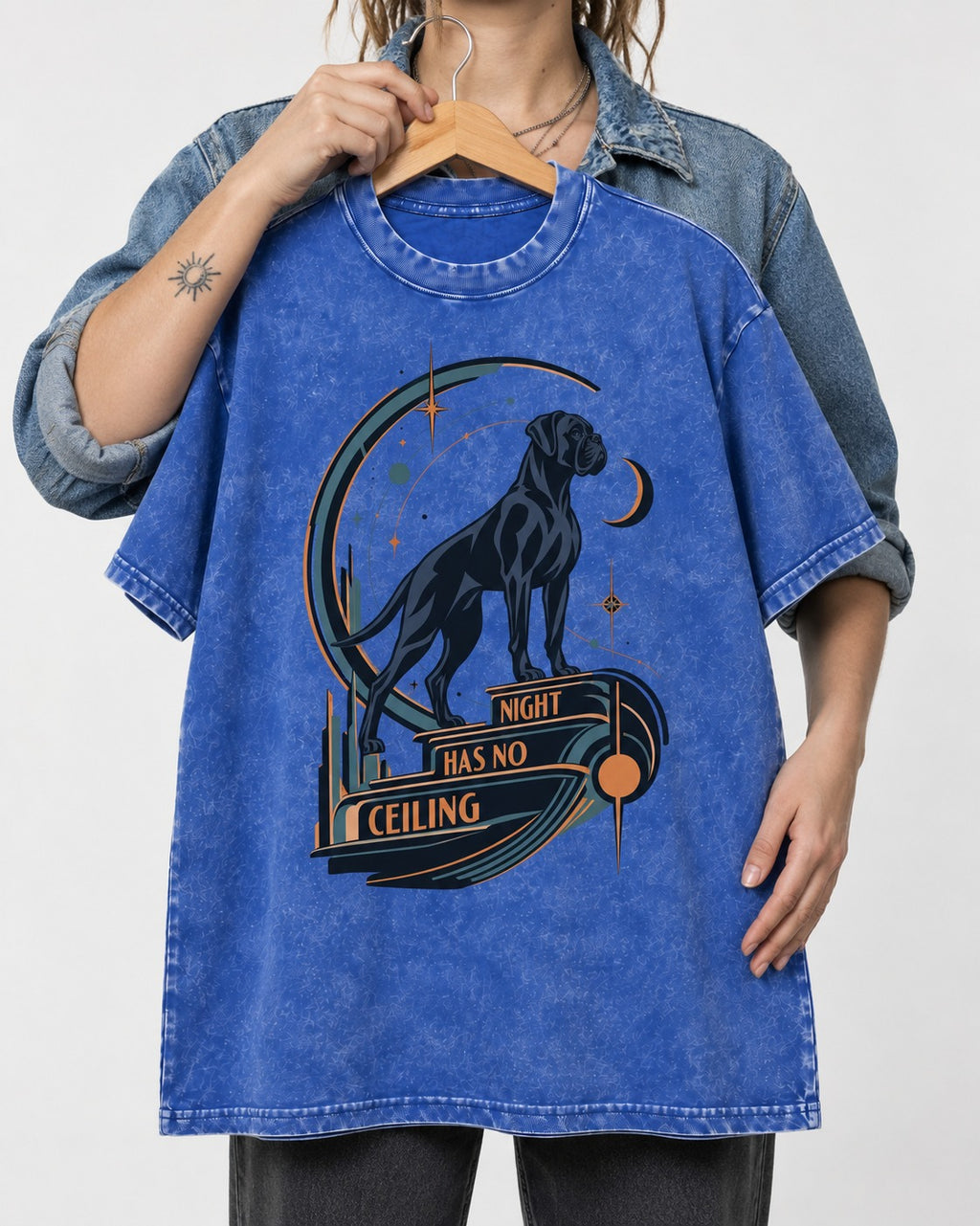 Night Has No Ceiling Boxer Cosmic Graphic Washed Tee in Royal Blue, held up on a hanger