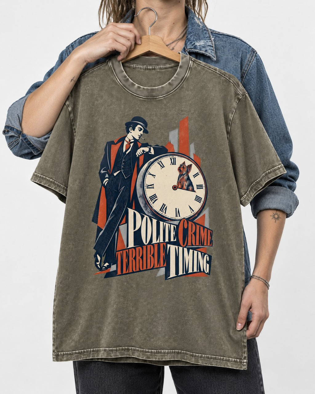 Yorkshire Terrier Polite Crime Terrible Timing Art Deco Clock Graphic Washed Tee in Army Green, held up on a hanger