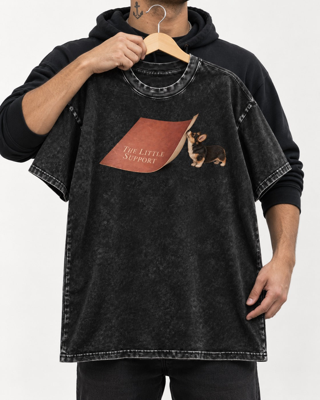 Corgi The Little Support Paper Graphic Washed Tee in Black, held up on a hanger