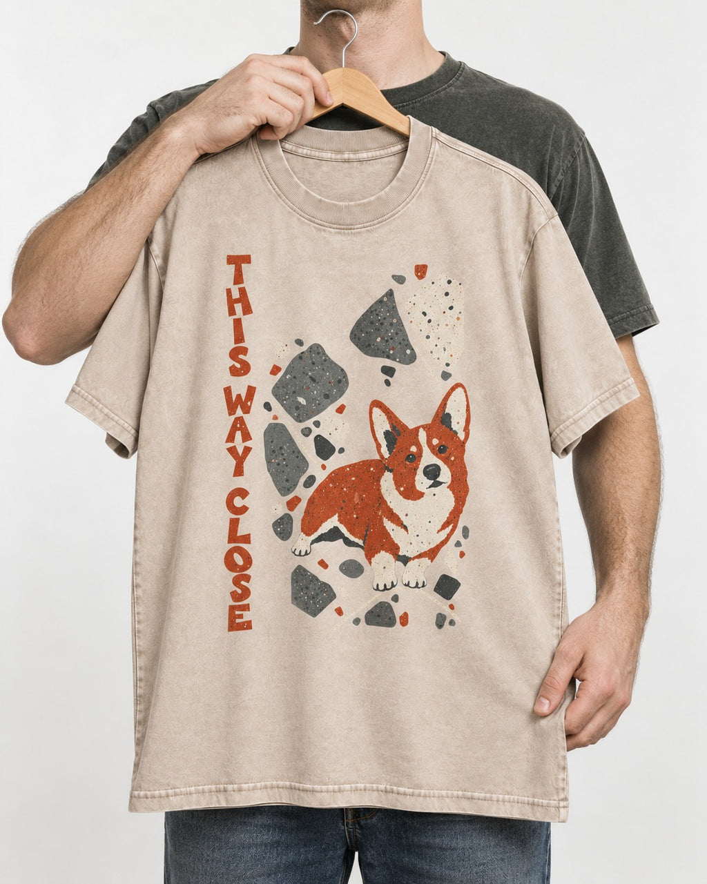 Corgi This Way Close Rubble Graphic Washed Tee in Apricot, held up on a hanger