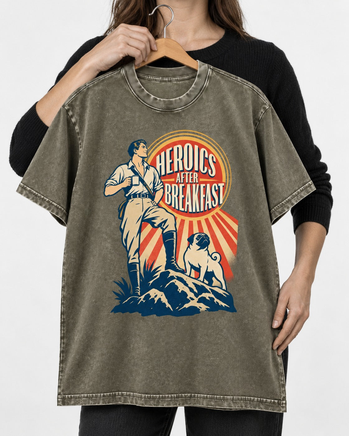 Pug Heroics After Breakfast Adventure Graphic Washed Tee in Army Green, held up on a hanger