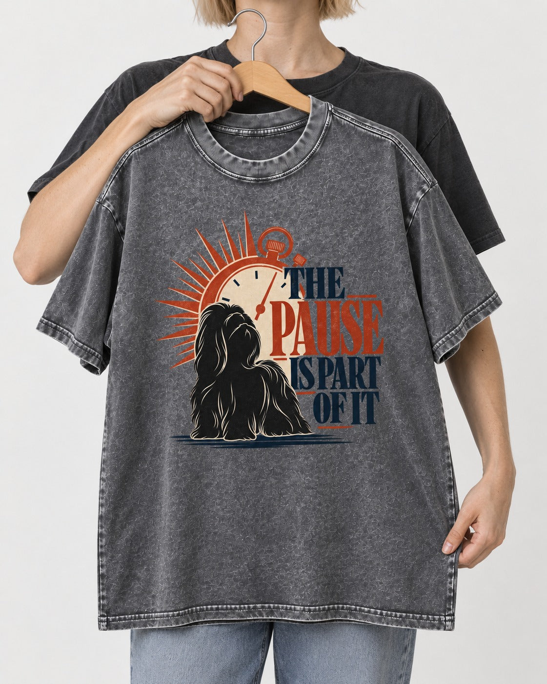 The Shih Tzu Pause Washed Tee in Gray, held up on a hanger