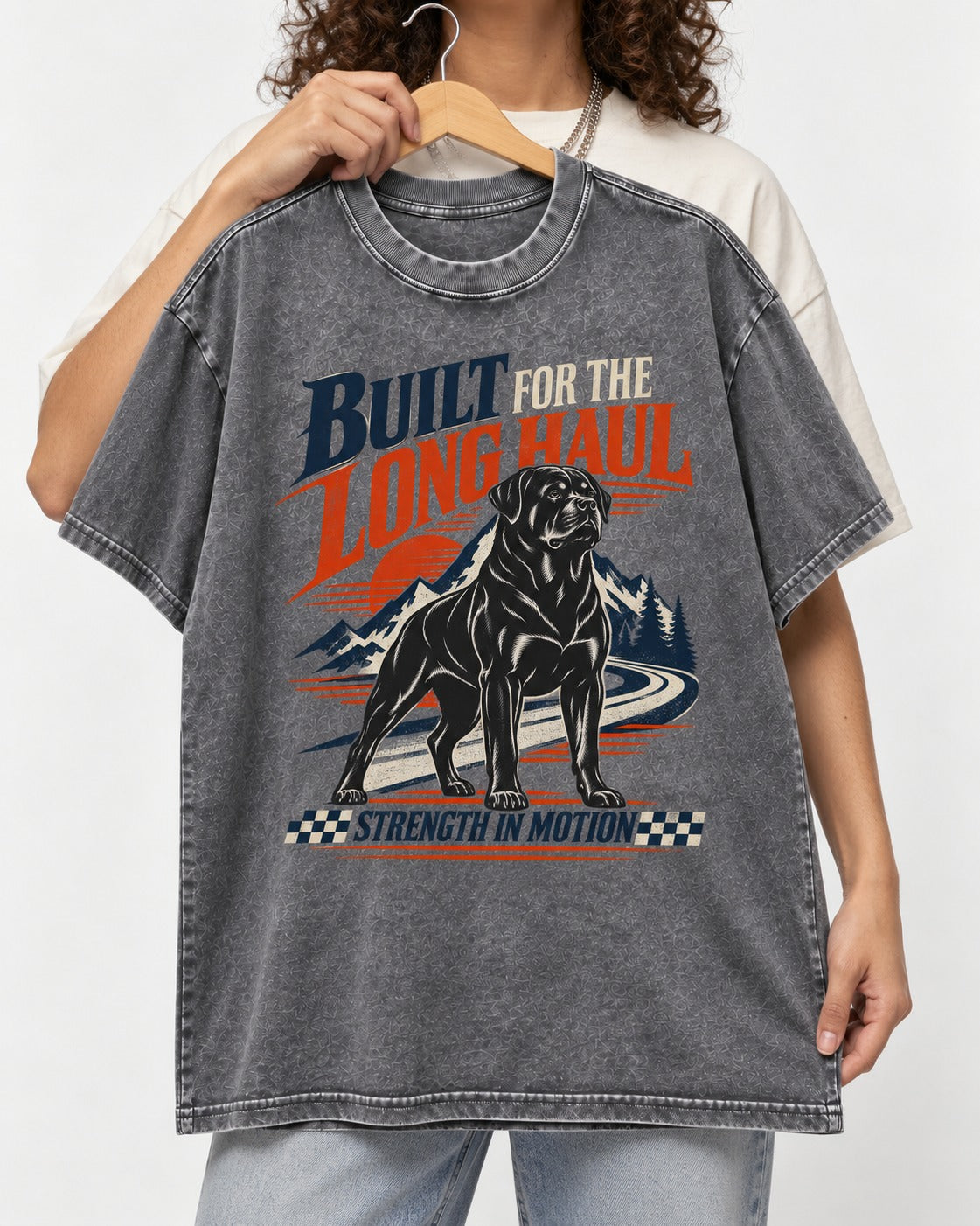 Built for the Long Haul Rottweiler Strength in Motion Washed Tee in Gray, held up on a hanger