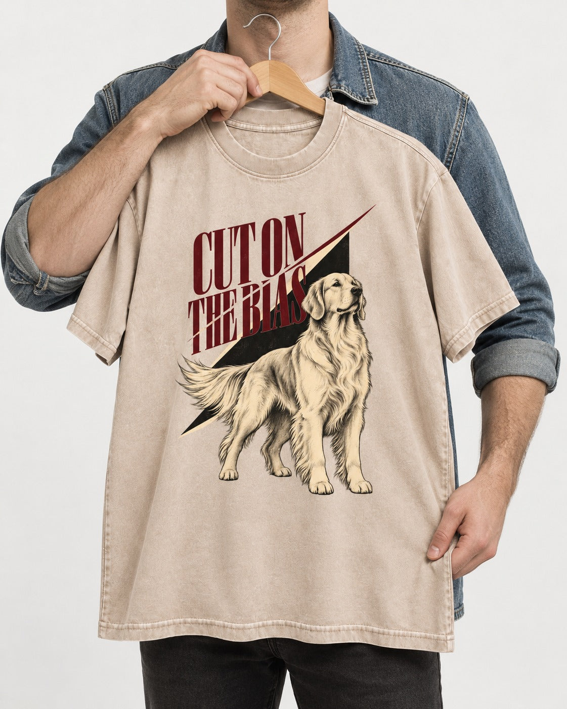 Cut on the Bias Golden Retriever Washed Tee in Apricot, held up on a hanger