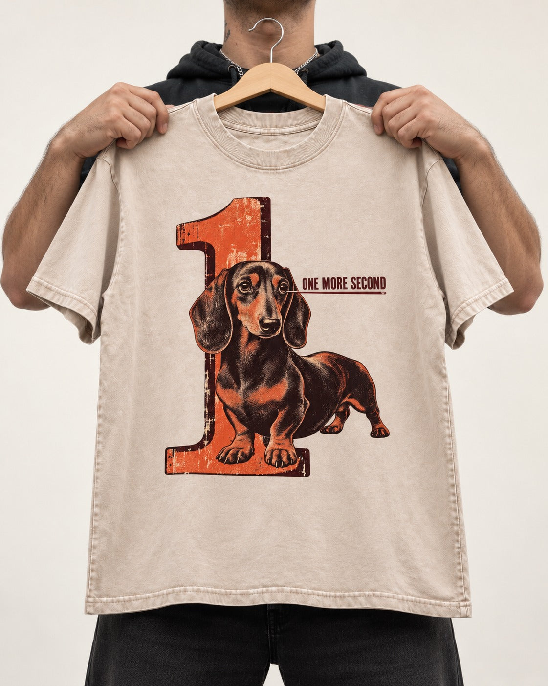 One More Second Dachshund Washed Tee in Apricot, held up on a hanger