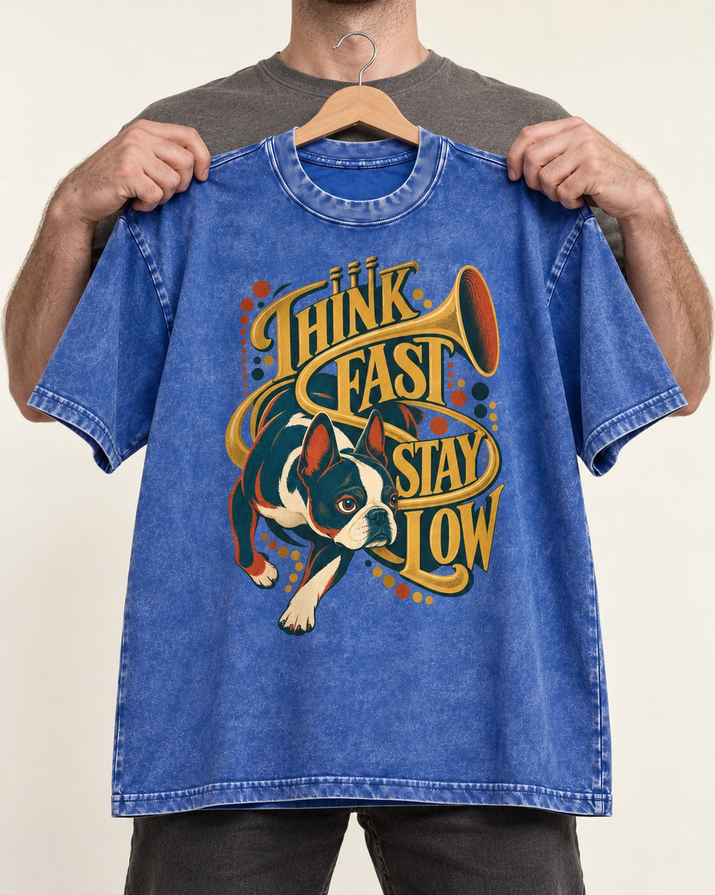 Boston Terrier Think Fast Stay Low Washed Tee in Royal Blue, held up on a hanger