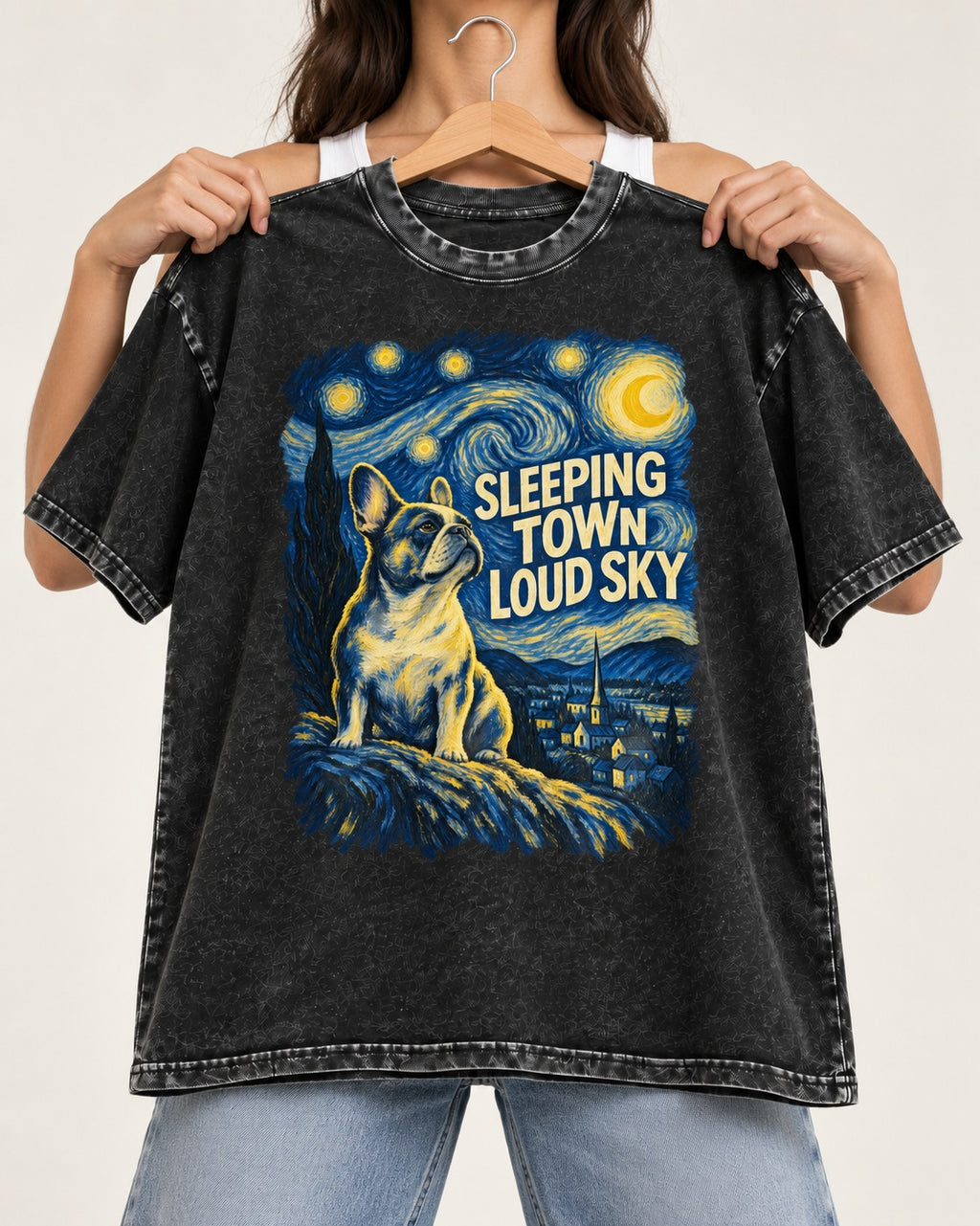 Frenchie Sleeping Town Loud Sky Graphic Washed Tee in Black, held up on a hanger