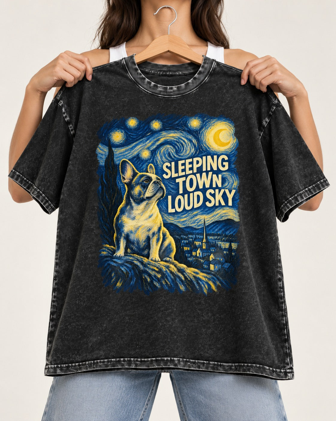 Frenchie Sleeping Town Loud Sky Graphic Washed Tee in Black, held up on a hanger