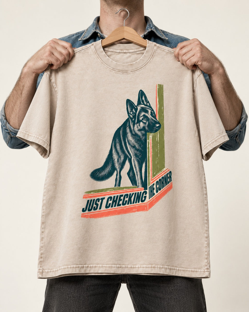 German Shepherd Dog Just Checking the Corner Washed Tee in Apricot, held up on a hanger