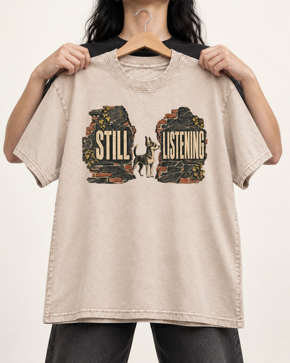 Chihuahua Still Listening Washed Tee in Apricot, held up on a hanger
