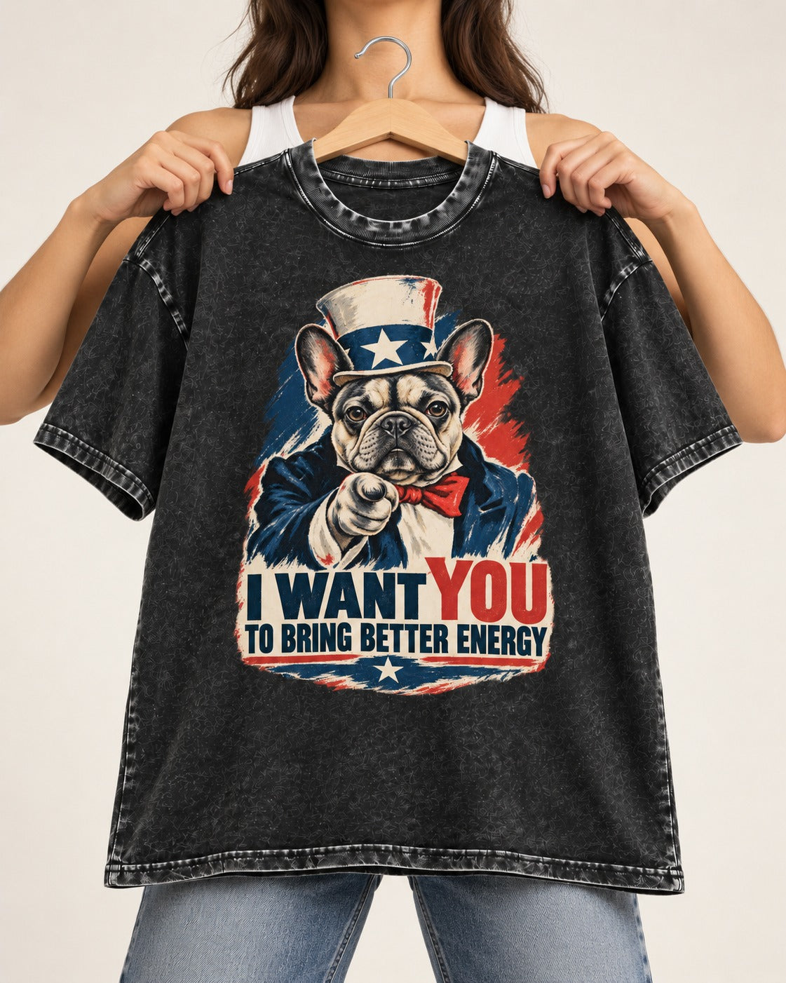 Frenchie I Want You to Bring Better Energy Recruitment Poster Graphic Washed Tee in Black, held up on a hanger