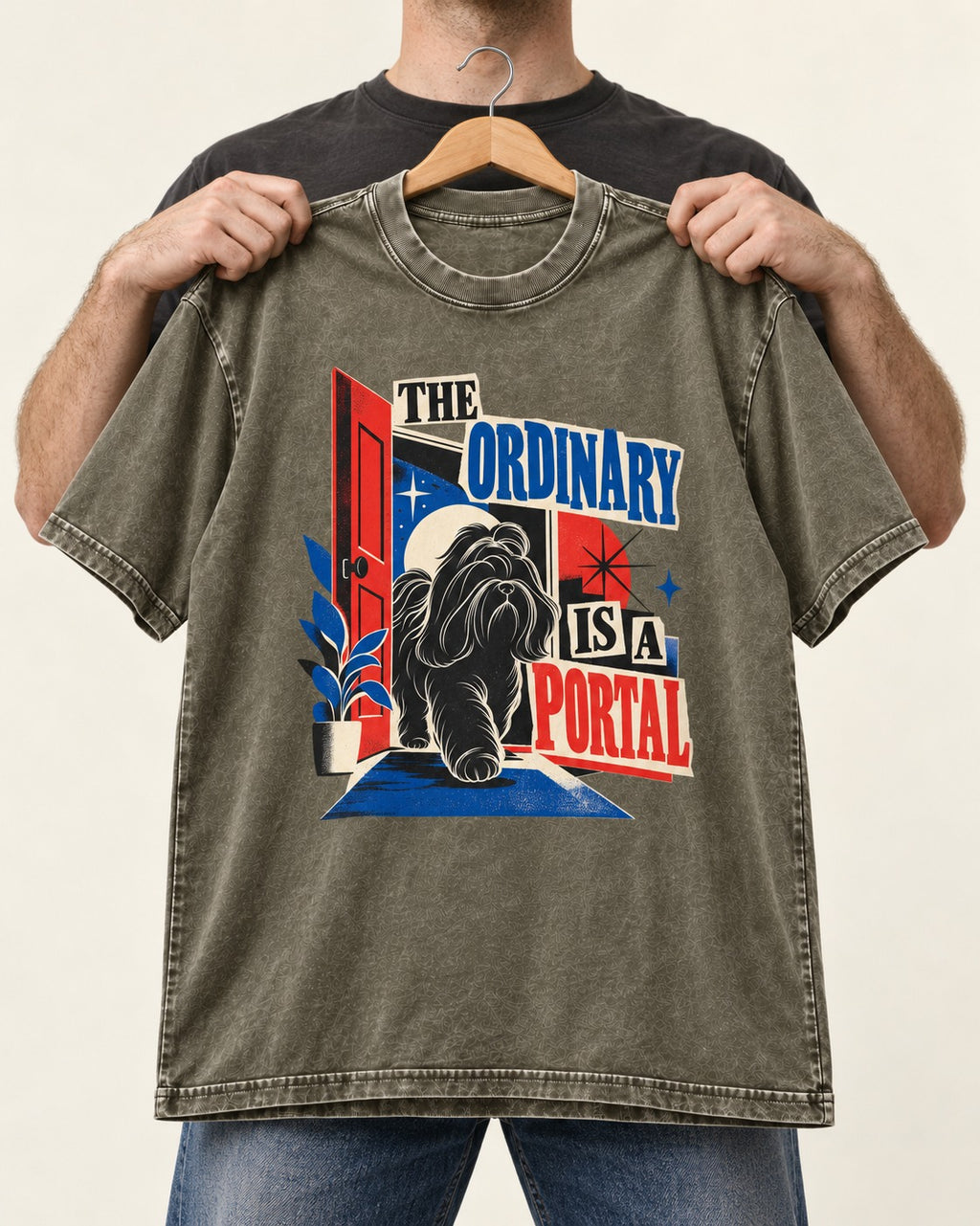 Shih Tzu The Ordinary Is a Portal Door Graphic Washed Tee in Army Green, held up on a hanger
