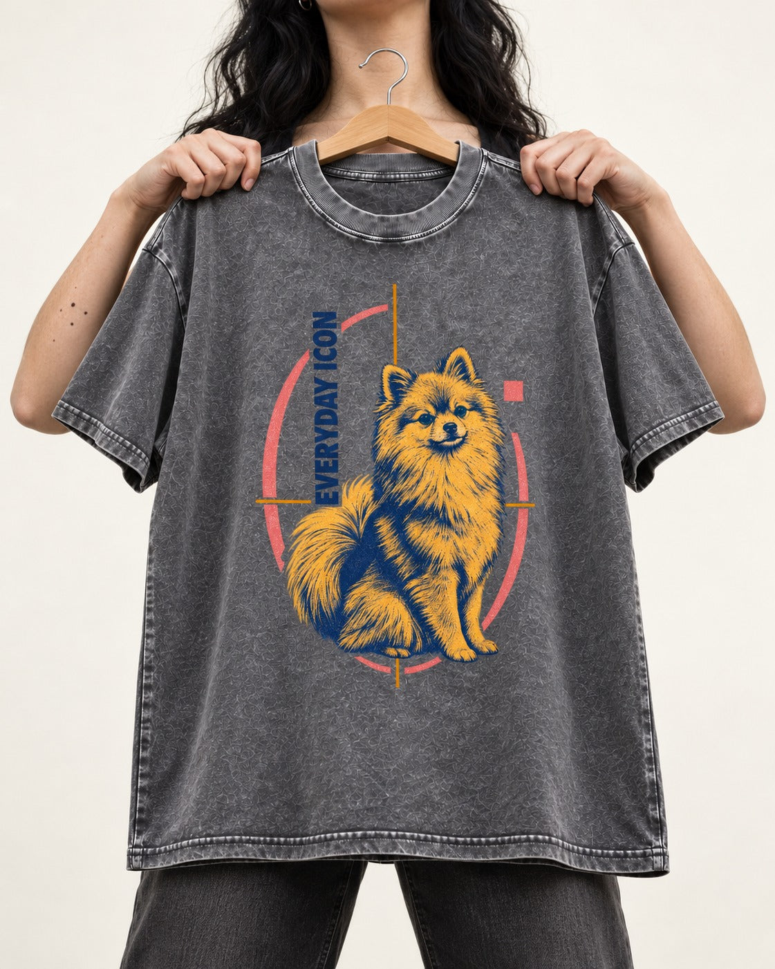 Pomeranian Everyday Icon Washed Tee in Gray, held up on a hanger